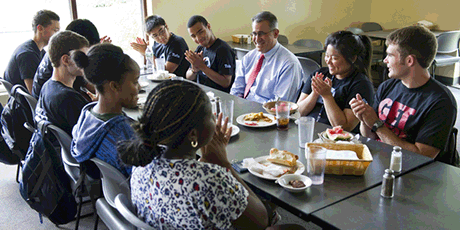 Image of Tony Monoco having lunch with students